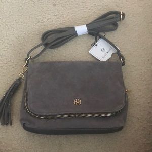 Never used, still has tags. Gray Purse